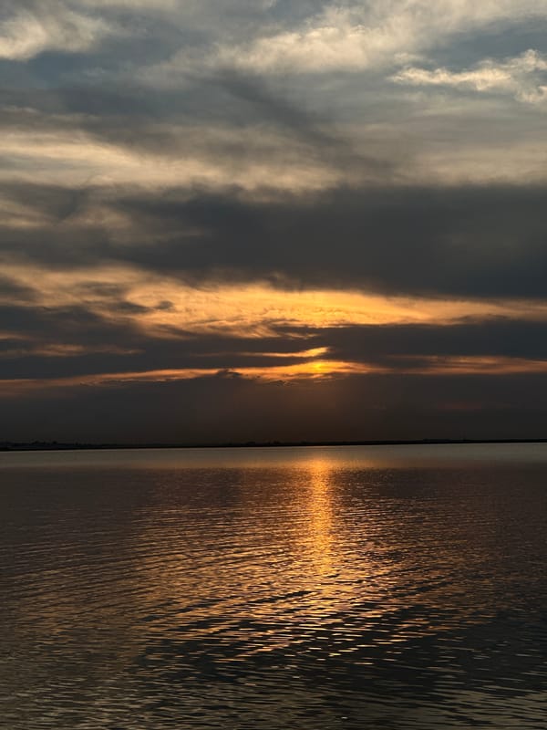 Stormy sunset over a Kokshetau lake, mid-July dusk