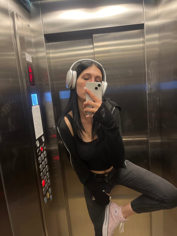 Selfies in reflective surfaces, elevator and window, same outfit.