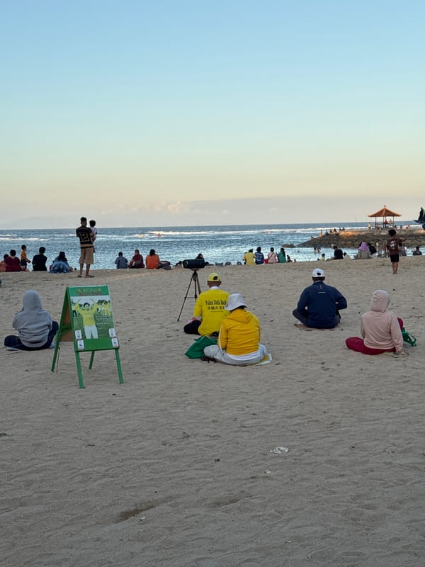 Dusk at a Kuta Selatan resort, with a group event on the beach