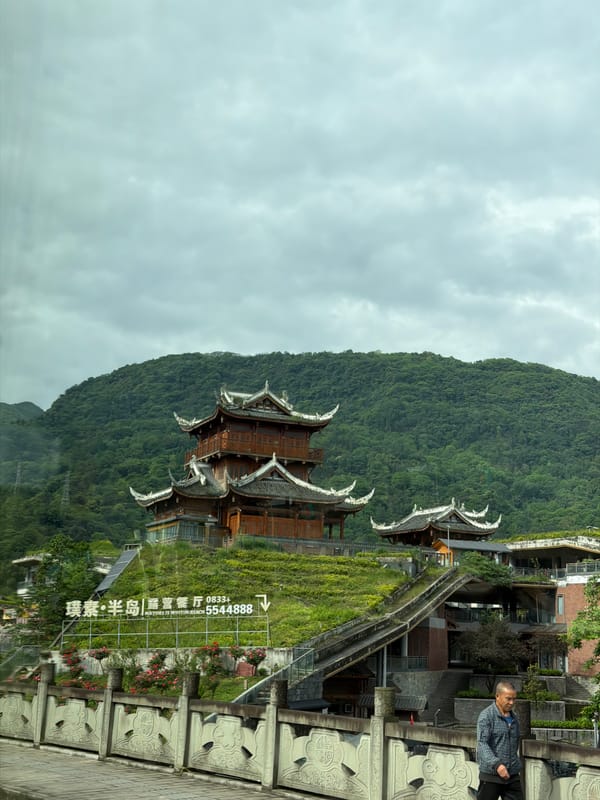 Traditional Chinese pagoda documented amid lush greenery in Huangwan