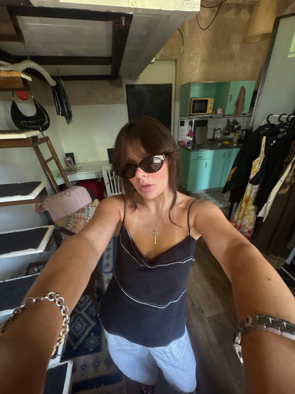 Back-to-back selfies in Tel Aviv, key necklace detail