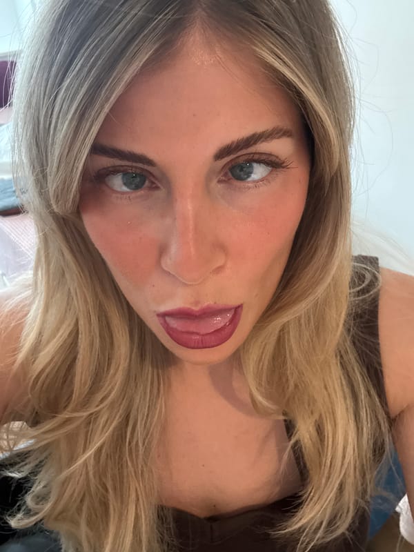 Woman takes selfies in Paris afternoon