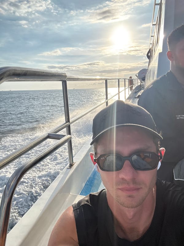 Man takes selfie on moving boat in Indonesian waters