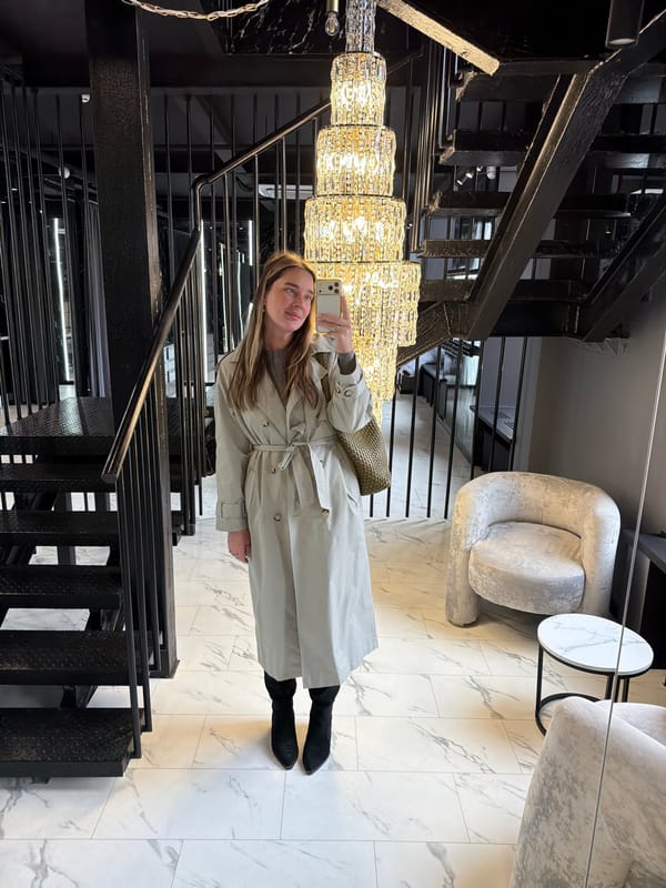 Woman takes selfies in upscale Moscow interior space