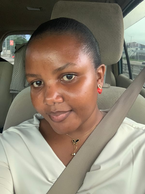 Woman passenger photographed in car in Dar es-Salaam
