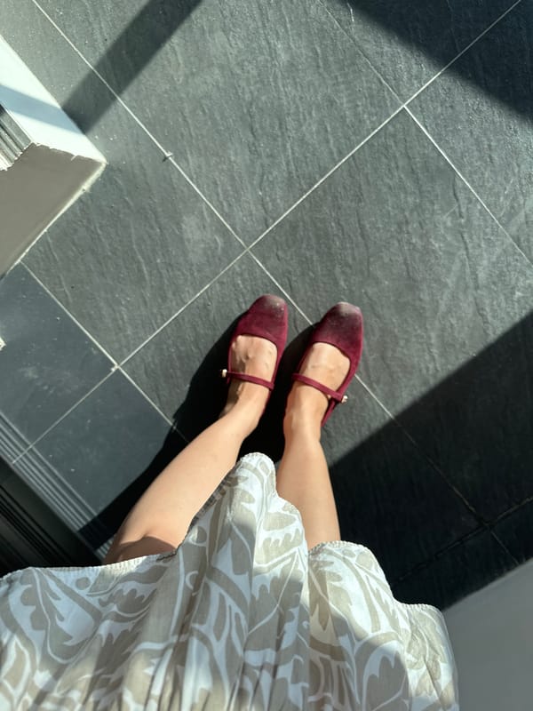 Person in burgundy shoes walks up stairs in Davao