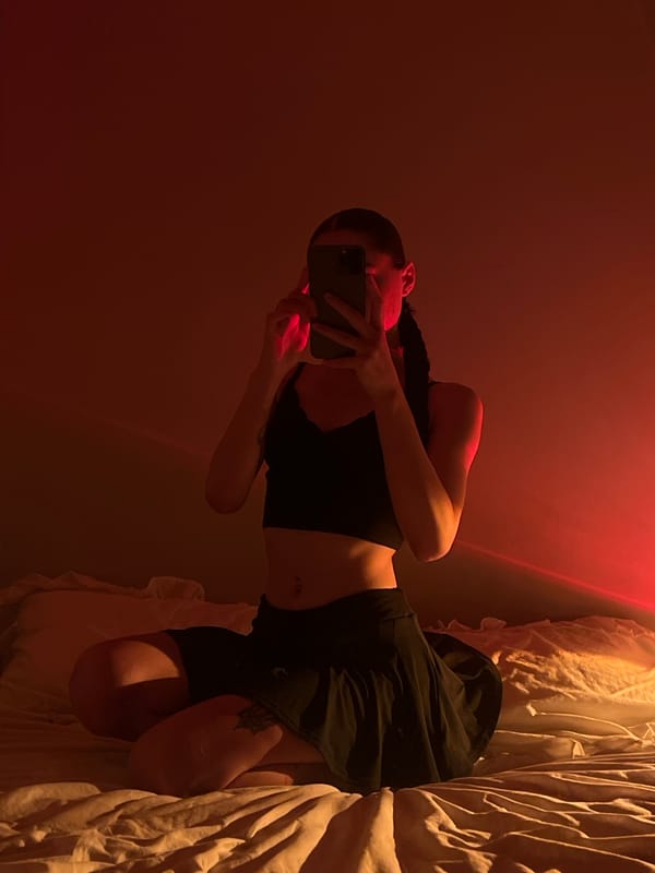 Red-lit bedroom selfie session in Ternopil, Ukraine