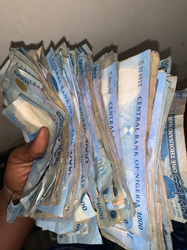 Currency and cleaning activities observed near Nigerian stadium