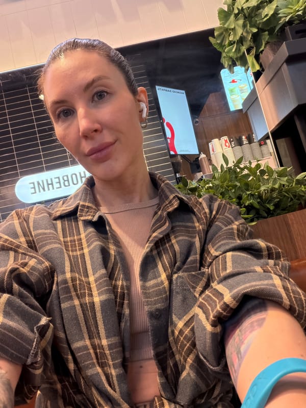 Woman takes selfie at busy cafe in Perm, Russia