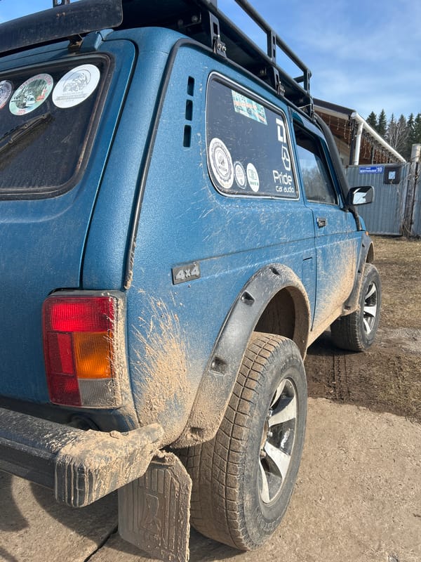 Muddy off-road vehicle documented in Russian town spring morning