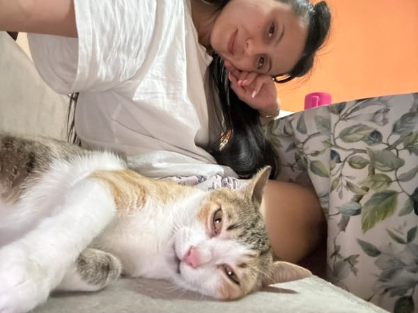 Woman takes selfies with cat at home in Bulgaria