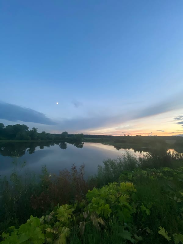 Quiet evening at a rural river in Yusupovo, Russia