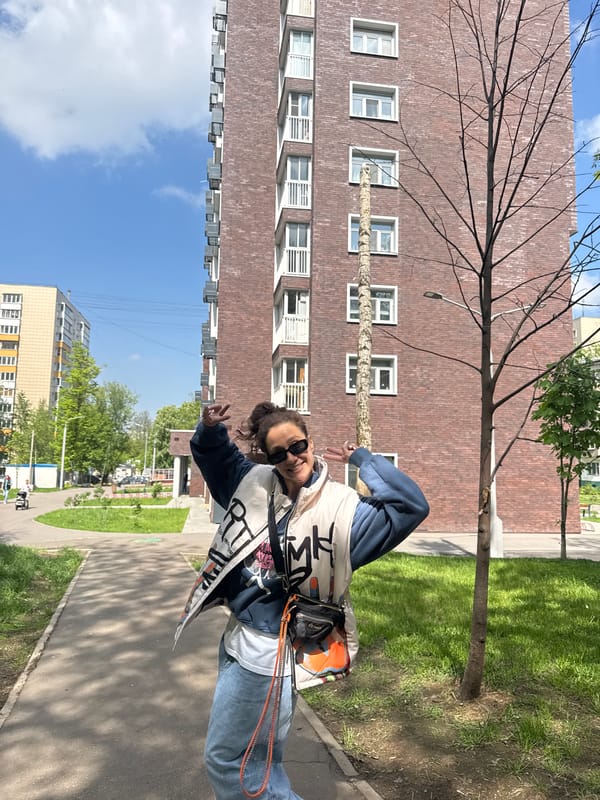 Person poses for photo in Moscow street scene