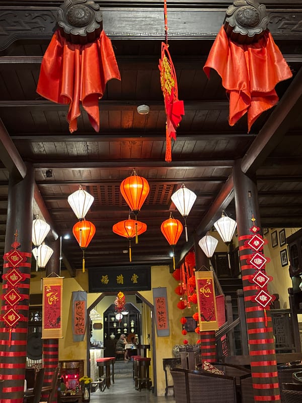 Traditional lanterns and eyeglass display captured in Hội An