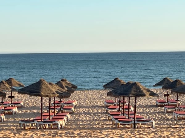 Quarteira promenade at golden hour, summer evening