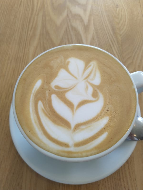 Coffee with flower latte art photographed in Moscow