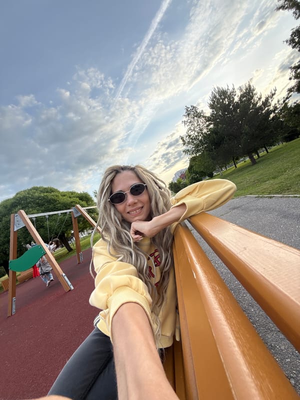 Woman and child enjoy playground visit in Russian towns