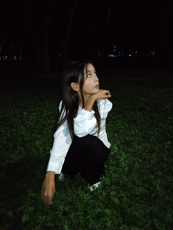 Nighttime park hangout in Bishkek, candid and close-up.