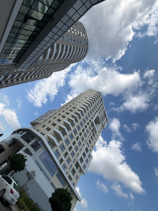 Modern Burgas high-rises and street-level scenes on a sunny morning