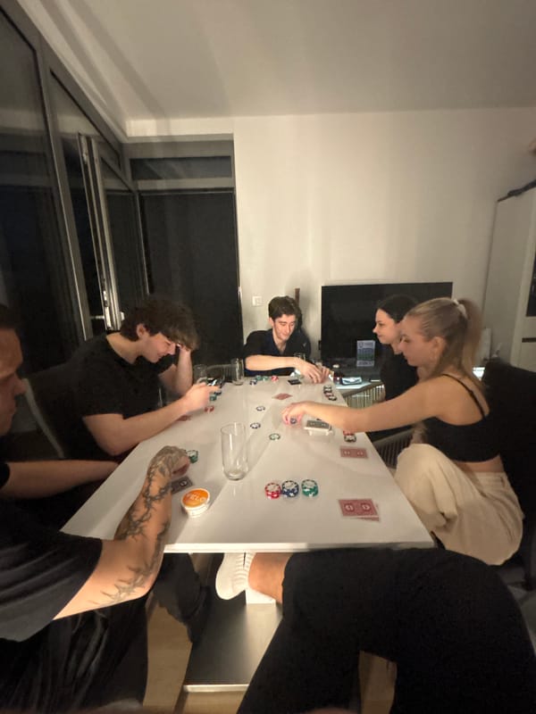 Young adults play poker in Bratislava apartment