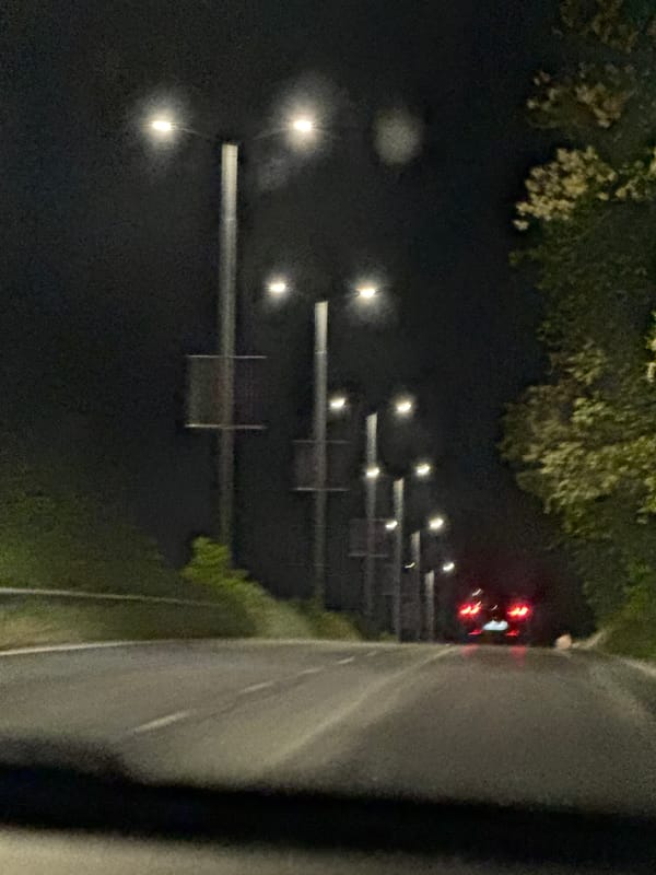Nighttime traffic observed on illuminated roadway in Ledenik, Bulgaria