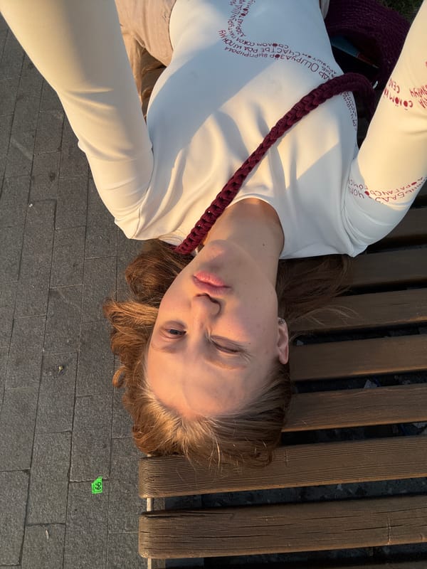 Woman rests on park bench in Perm, Russia