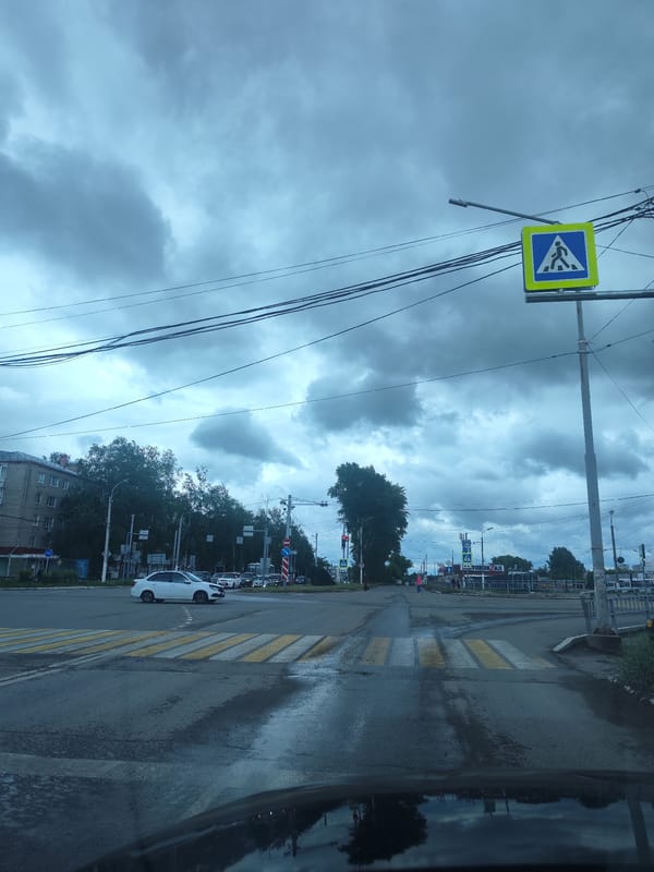 Wet roads observed at Chaikovsky intersection amid cloudy conditions