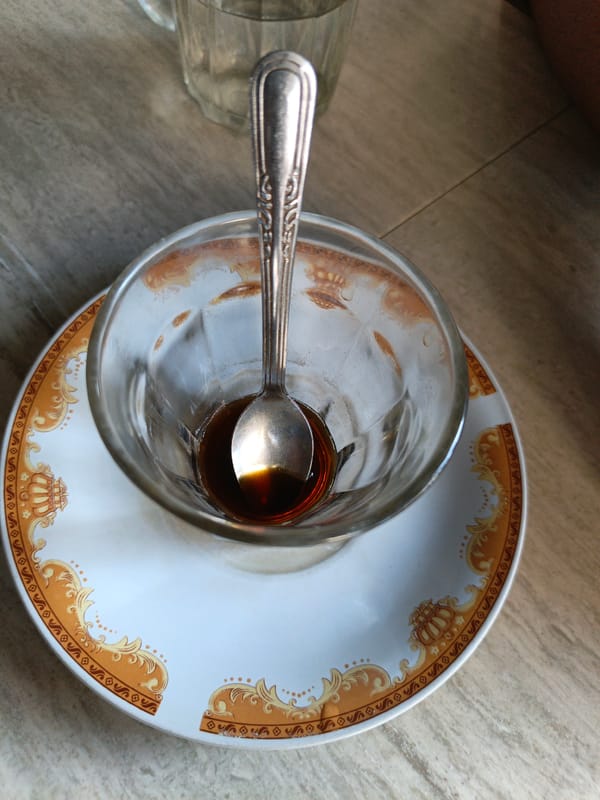 Used glass cup with spoon observed in Lhokseumawe