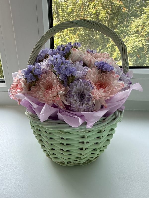 Pink and white flower arrangements, plus a reptile terrarium