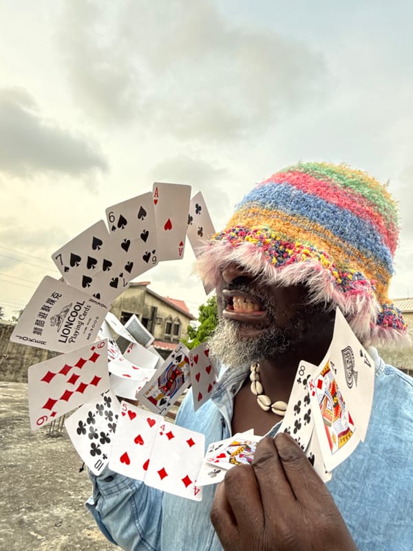 Street magician performs card tricks on rooftop in Nigeria