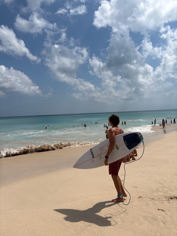 Sunny afternoon at Bingin Beach, Bali — surfing and shoreline activity