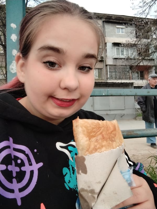 Woman enjoys traditional burek breakfast in Plovdiv, Bulgaria