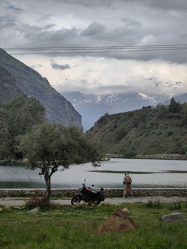 Lake, waterfall, and mountain roads at Yamling
