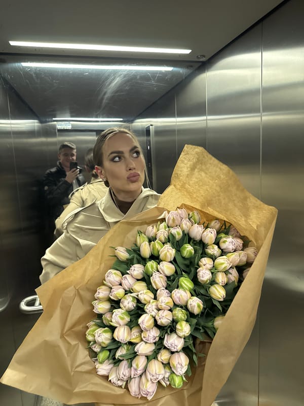 Woman in red armchair scene observed in Warsaw apartment