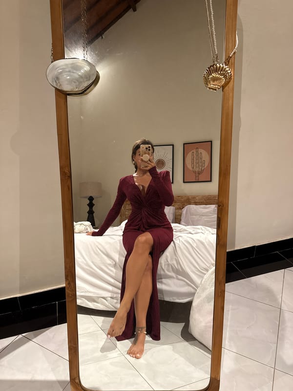 Woman takes bedroom selfies in North Kuta hotel room