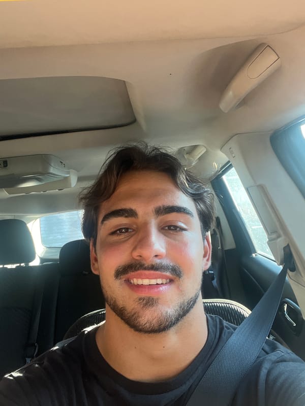 Man photographed smiling in car in Avellaneda, Argentina
