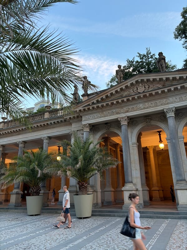 Evening stroll along Karlovy Vary's historic colonnade and river promenade