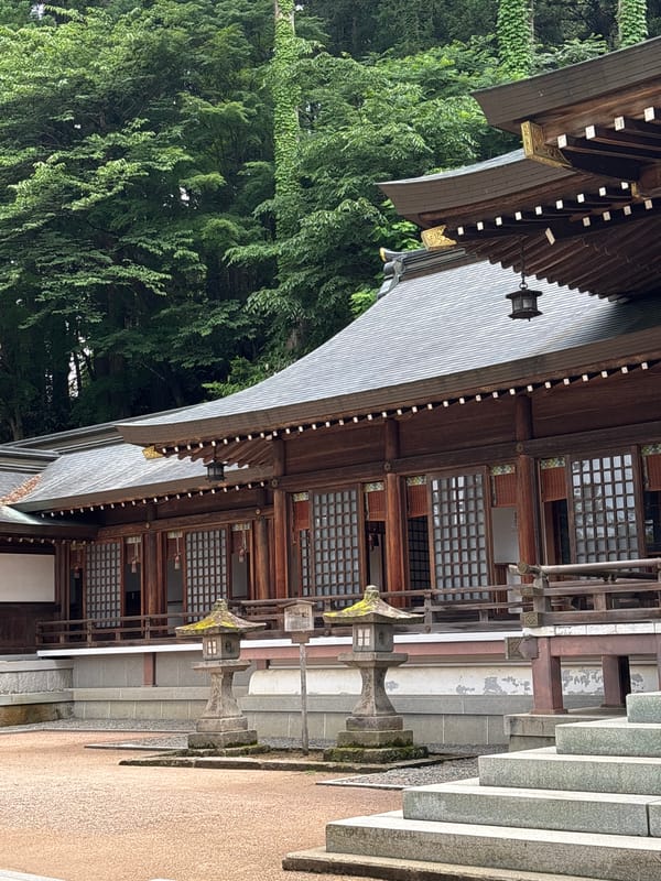 Tourist documents pre-dawn temple visit in Takayama, Japan