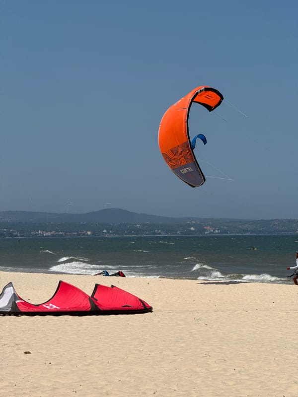 Kitesurfers work the wind at Mũi Né Beach