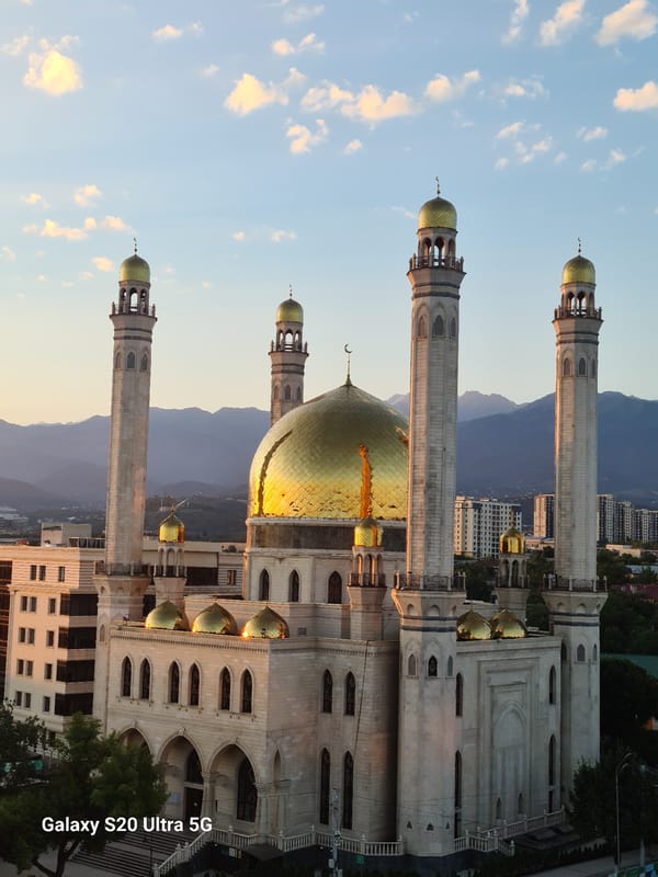 Almaty at sunset and moonrise, landmarks and skyline