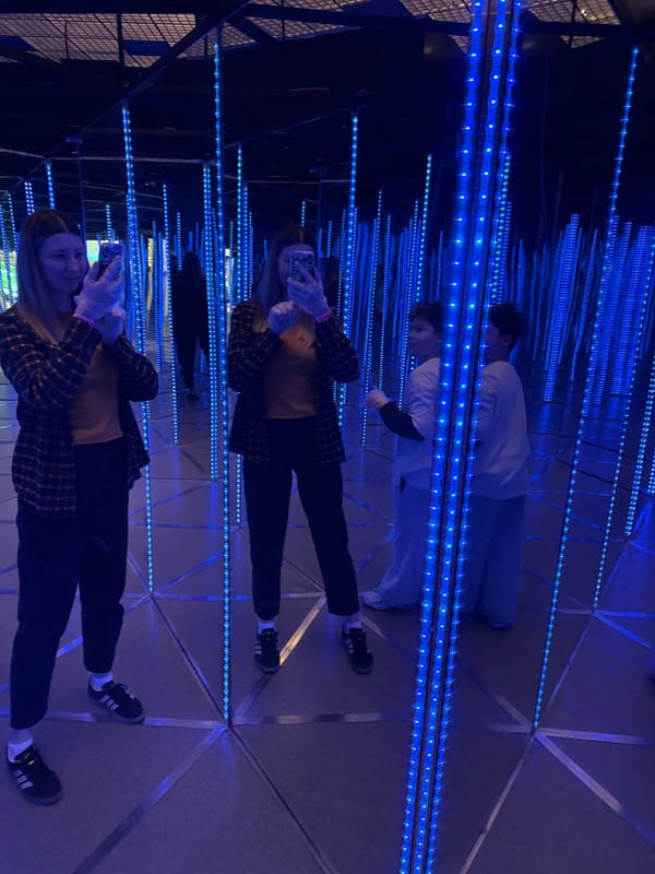 Visitors explore blue LED infinity mirror maze at Moscow museum