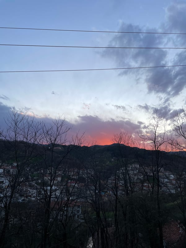 Sunset colors paint evening sky over Zlatograd, Bulgaria
