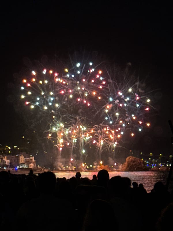 Fireworks display over the water draws crowds to Blanes beach