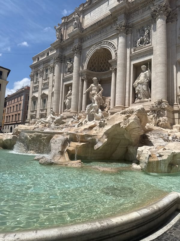 Tourists gather at Rome's Trevi Fountain on sunny day