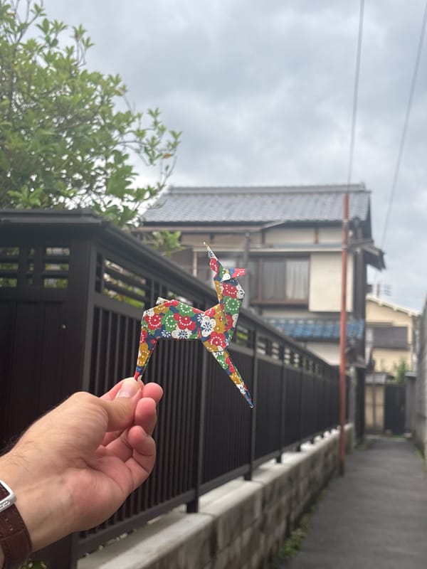 Origami crane displayed on residential street in Nara