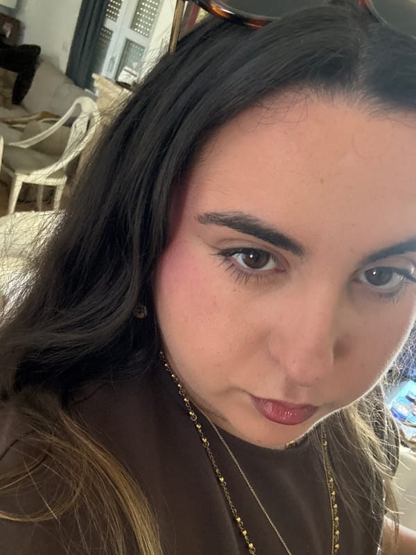 Woman photographs religious certificate in Spanish residential area