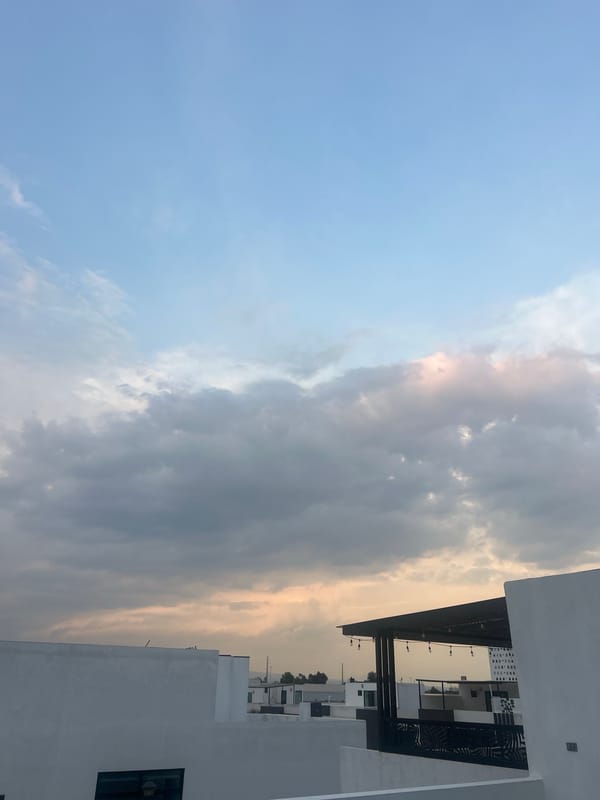 Witness documents cloudy sky, modern building in Cholula, Mexico