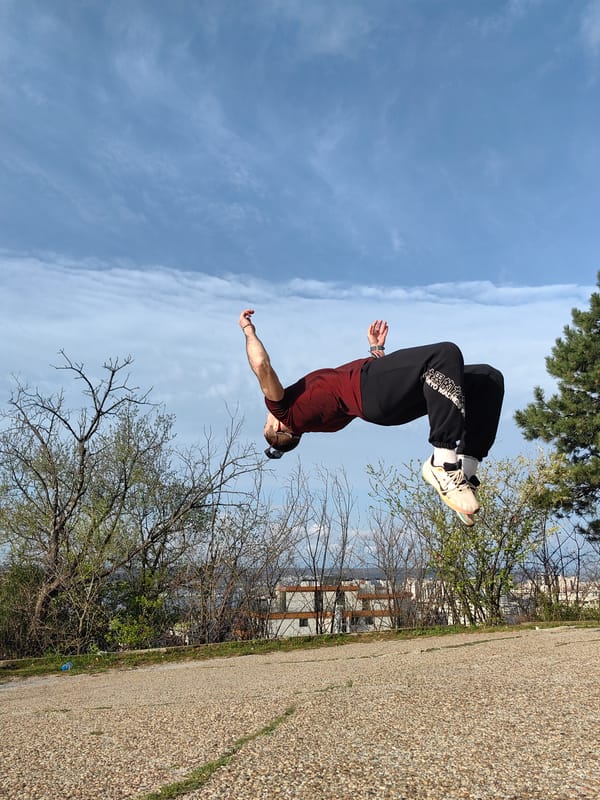 Person performs backflip outdoors in early morning Varna
