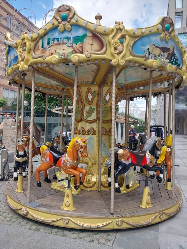 Dnipro plaza buzzes with fountains, carousels, and street life