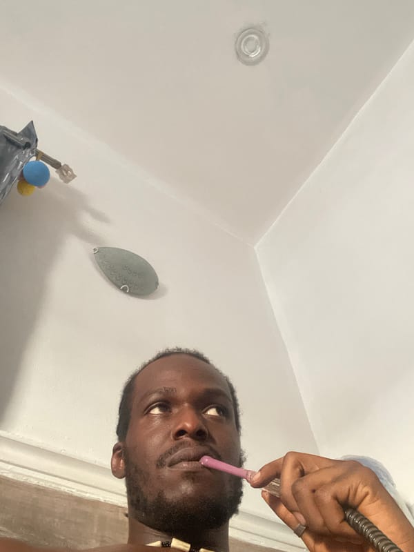 Man smokes hookah in bathroom, Kuchingoro Nigeria